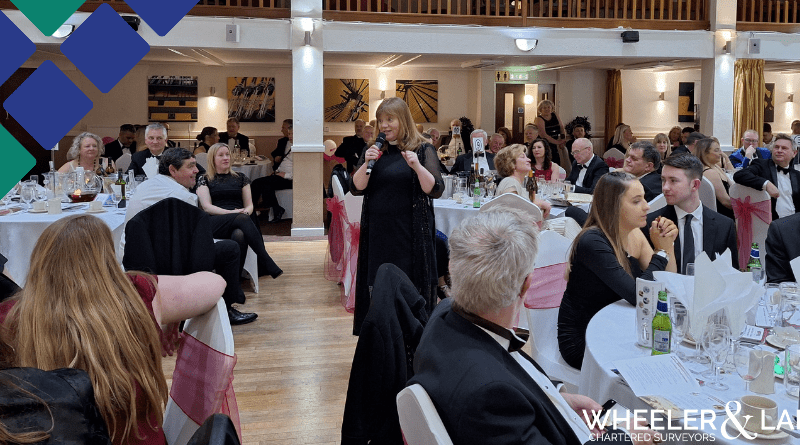 Kate Bottley roving the room talking with dinner guests listening