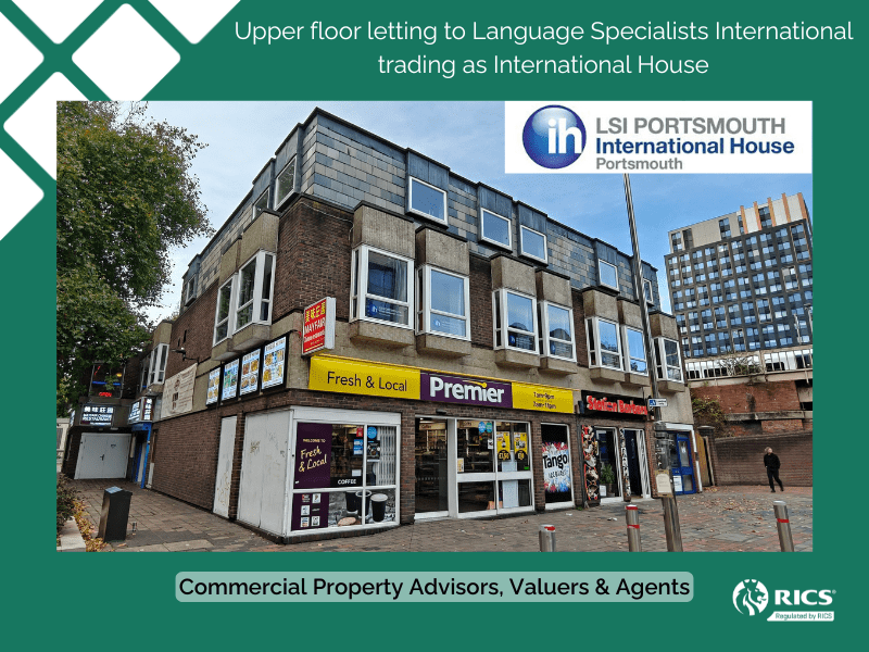 Corner view of a detached commercial property with a convenience shop and barbers at ground level and two floors above used as a language school, blue sky in background and tree to the left.