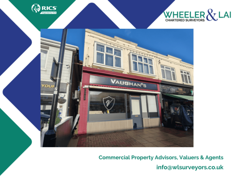Vaughan sign on shop front, with blue sky in background.