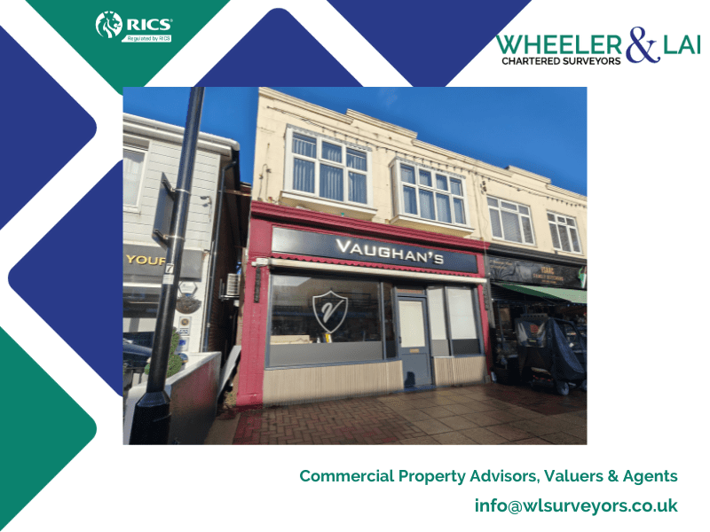 Vaughan sign on shop front, with blue sky in background.